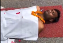 man laying on road like dead for reel video 