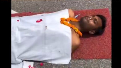 man laying on road like dead for reel video 