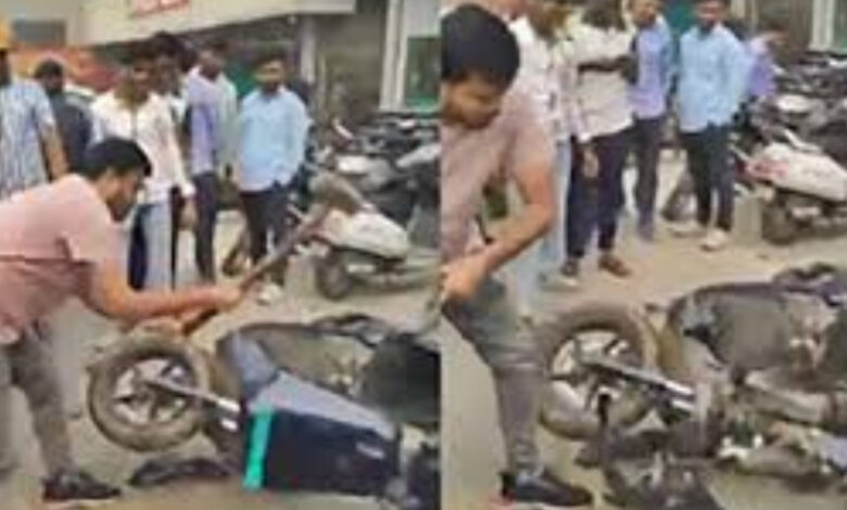 man smashed ola e scooter